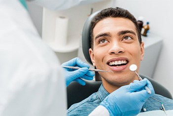 patient visiting dentist for dental care